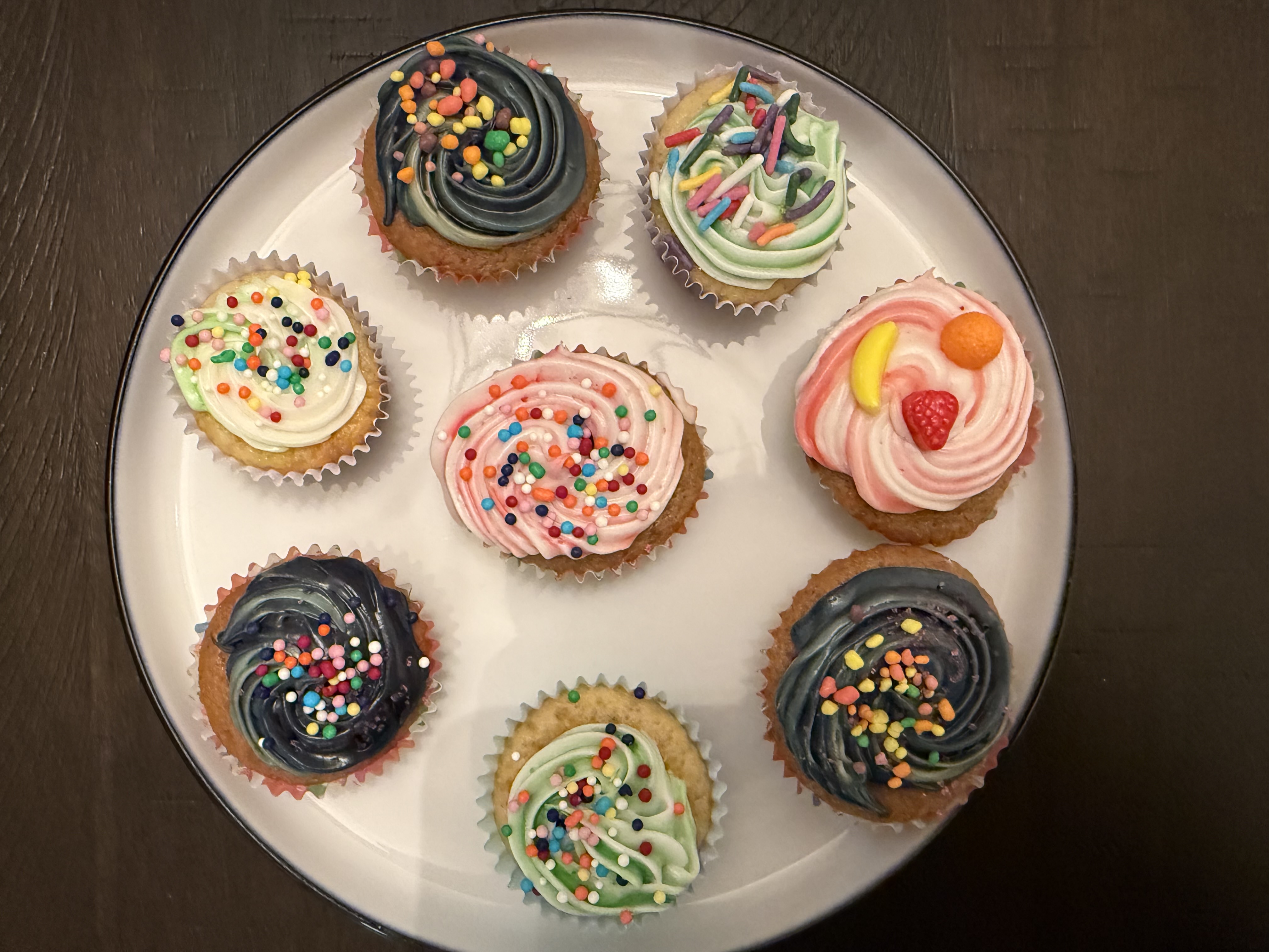 Colorful cupcakes with decorated frosting